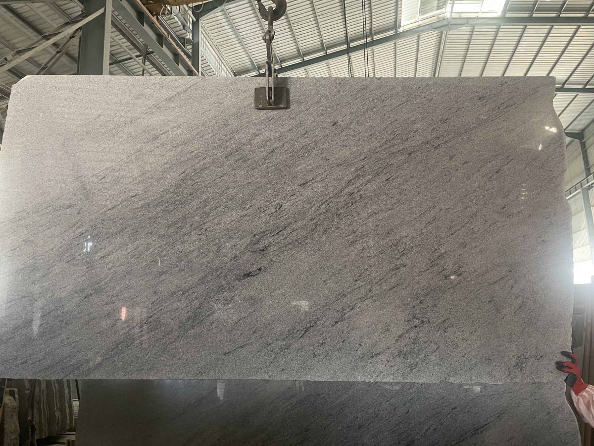 Chinese Viscount White Granite Slab Chinese Viscount White granite slab with a grey-white background and dark flowing mineral patterns